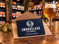 Cadeaubon van Smokkelaar de Winkel in een kraft envelop op de toonbank